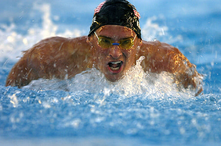 man wearing goggles while swimming on pool thumbnail