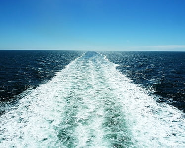 body of water under blue sky thumbnail
