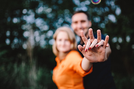 Young couple holding hands outdoors thumbnail