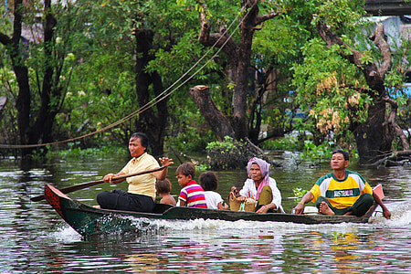 people riding boat on body of water thumbnail