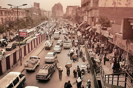 people near on vehicles and building thumbnail