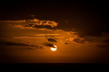 setting sun over horizon thumbnail