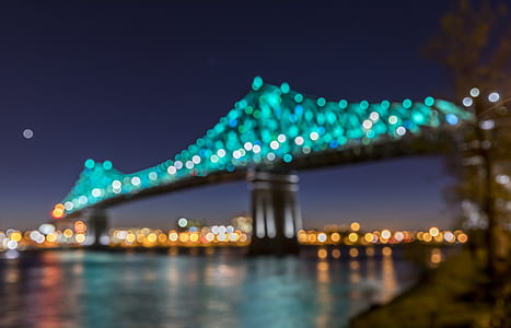 low angle photography gray concrete bridge with lights at night thumbnail