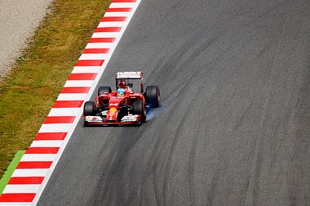 red Formula 1 on road thumbnail