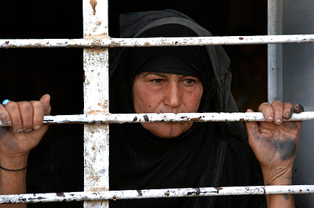 woman on white grill gate thumbnail