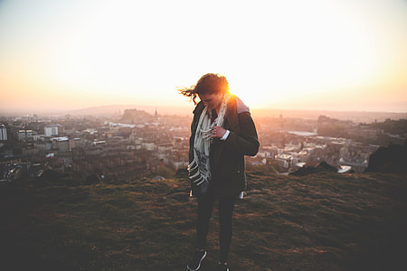 woman standing on mountain thumbnail
