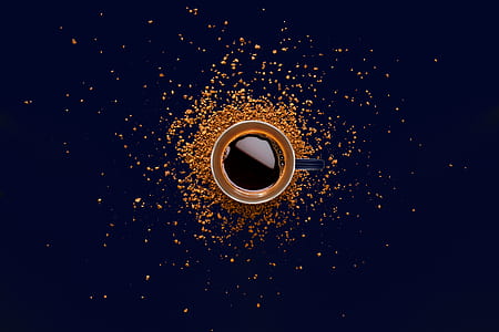 flat lay photograph of brewed coffee in mug thumbnail