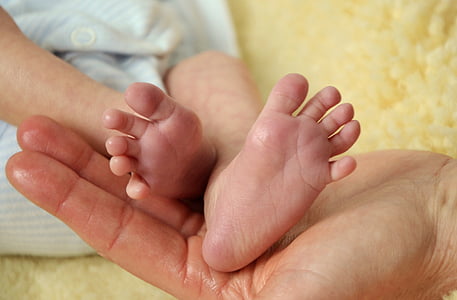 person holding baby's feet thumbnail