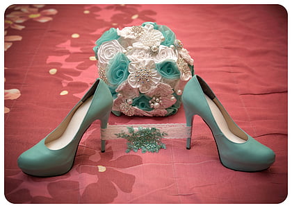 pair of teal leather heeled shoes near flower decors thumbnail