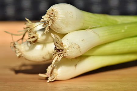 five string onions on brown surface thumbnail