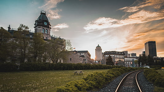 railroad near concrete buildings thumbnail