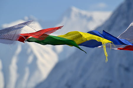 assorted-color sheets overlooking white snow covered mountains thumbnail