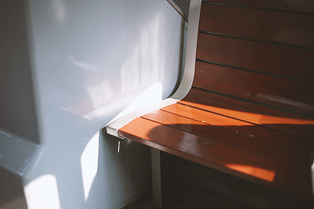empty bench beside wall thumbnail