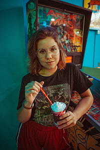 woman standing near pinball machine thumbnail