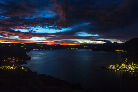 landscape photography of lighted islands near body of water thumbnail