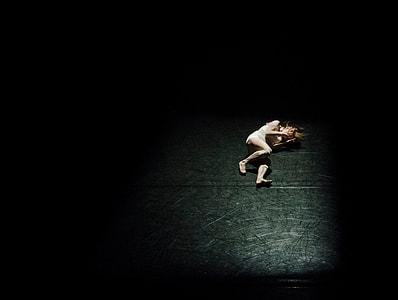 woman laying on black surface thumbnail
