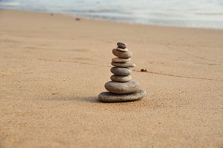stack of stones near seashore during daytime thumbnail