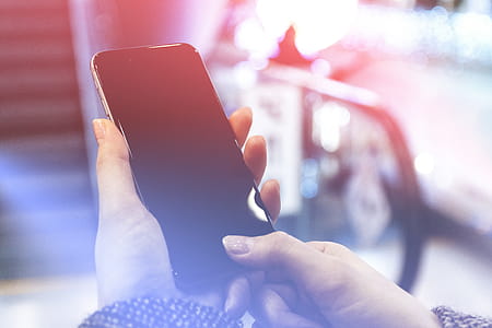 Modern smartphone in the women hands. Unlock phone with finger print thumbnail