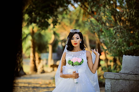woman standing beside rock formation thumbnail