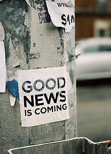 white good news is coming printed paper mounted on gray post thumbnail