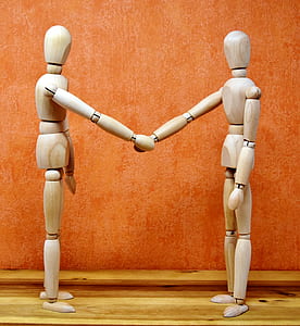 two brown wooden mannequin thumbnail