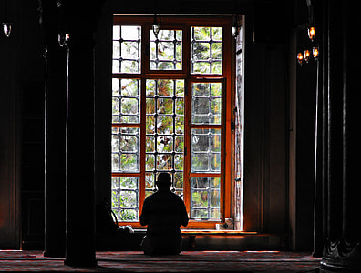 silhouette of man sitting facing window thumbnail