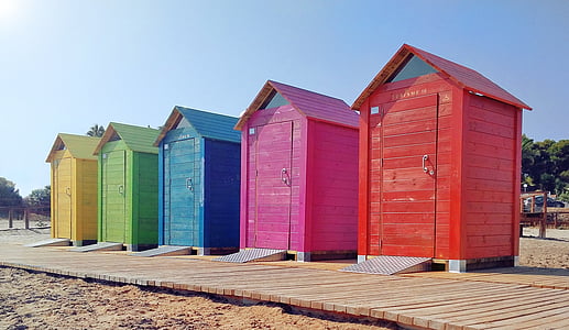 five multicolored outdoor toilet booths thumbnail