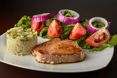 fish steak on white ceramic plate thumbnail