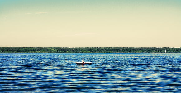 person rowing on boat thumbnail