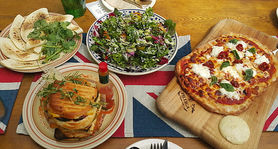 pizza placed on brown chopping board thumbnail