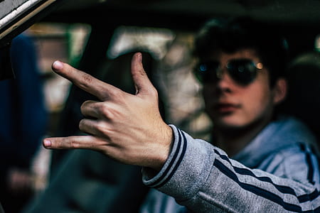 man sitting inside car thumbnail