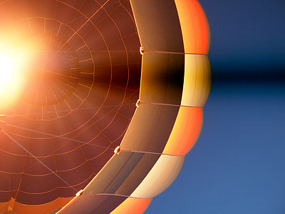 orange hot air balloon under clear blue sky thumbnail