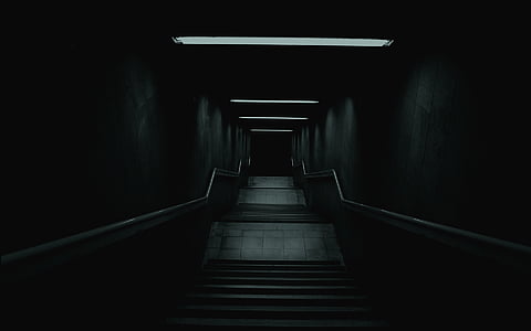 stairs leading towards dark path thumbnail