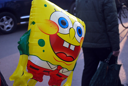 person holding SpongeBob SquarePants balloon thumbnail