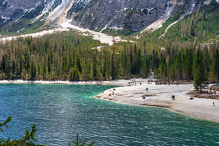 people standing near body of water thumbnail