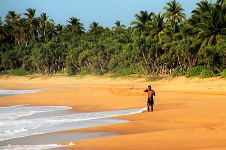 person standing near of body of water thumbnail
