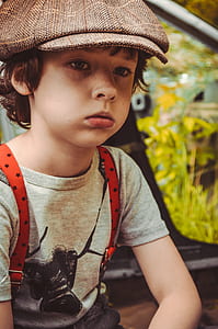 boy wearing brown hat thumbnail