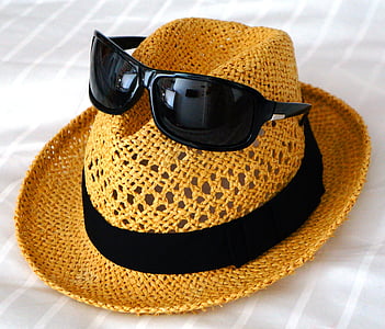 black sunglasses on brown hat thumbnail
