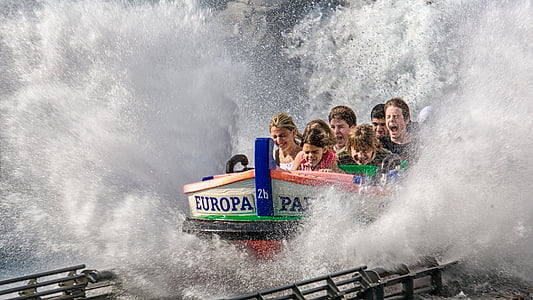 people riding theme park ride thumbnail
