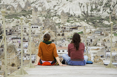 two women sitting on dock thumbnail