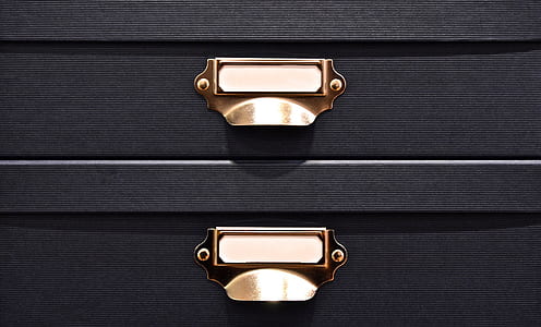 black and brass-colored drawers thumbnail