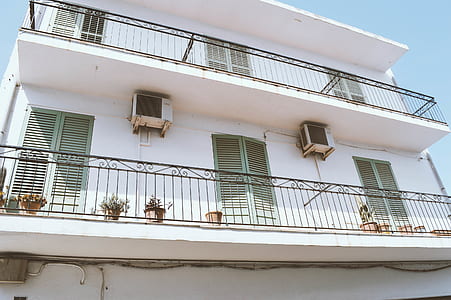 white concrete 2-storey buildng thumbnail