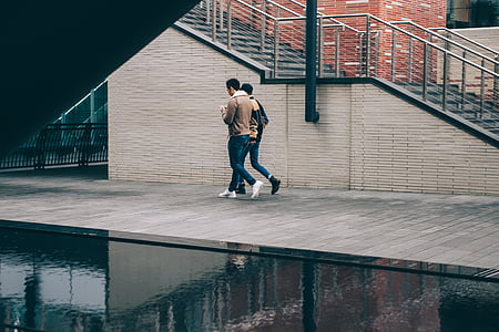 men walking on side of road thumbnail