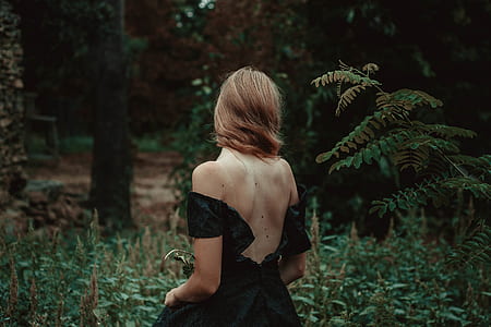 woman wearing black sleeveless in the middle of forest thumbnail