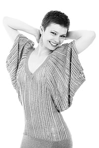 grayscale photo of woman wearing v-neck batwing sleeved dress thumbnail