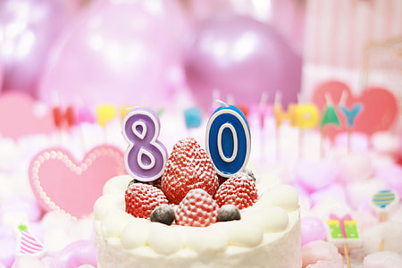 selective focus photo of blue 80 birthday  candle thumbnail