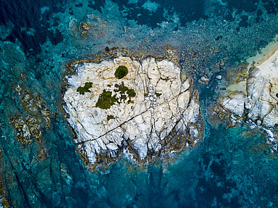 rock formation in sea water during daytime thumbnail