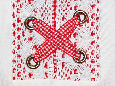 close-up of white and red crochet thumbnail