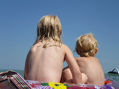 girl and boy seating during daytime thumbnail
