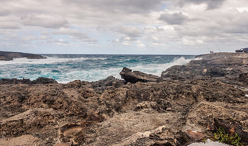 cliff near body of water thumbnail